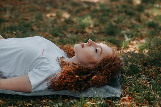 Woman Relaxing On Ground
